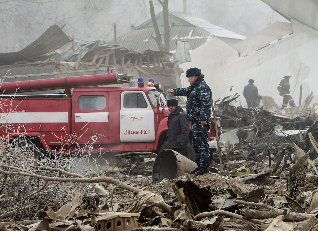 Rescue teams are seen at the crash site of a Turkish cargo jet near Kyrgyzstan's Manas airport outside Bishkek, January 16, 2017. (Reuters Photo)