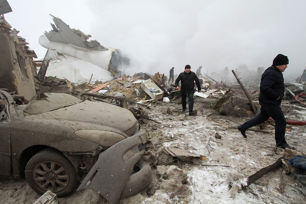 Rescue teams are seen are seen at the crash site of a Turkish cargo jet near Kyrgyzstan's Manas airport outside Bishkek, January 16, 2017. (Reuters Photo)