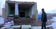 A man looks at a house whose wall collapsed in the earthquake in Özpınar village, Van, Feb. 24, 2020. (İHA Photo)