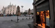 A bar next to the Piazza del Duomo in central Milan closes at 6 p.m. on Feb. 24, 2020, following security measures taken in northern Italy against the COVID-19 the novel coronavirus. (AFP Photo)