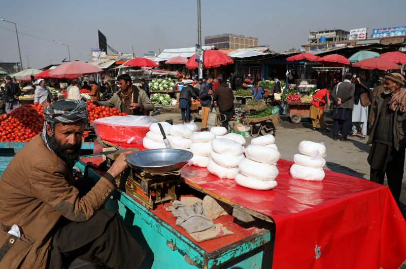 A man selling cheese waits for customers in Kabul, Afghanistan, Feb. 22, 2020. (Reuters Photo)