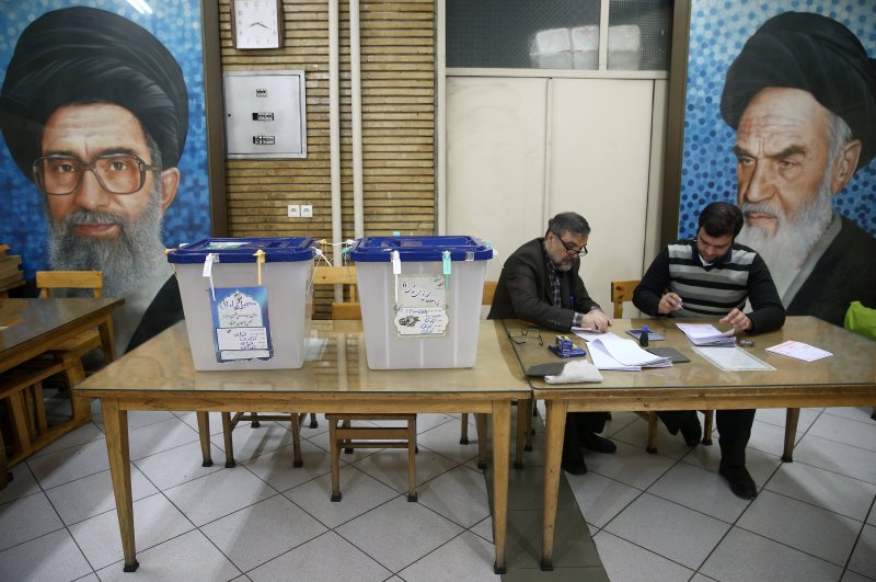 Polling officers are seen at a polling station during the Iranian parliamentary elections, Tehran, Feb. 21, 2020. (REUTERS Photo)