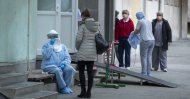 A health worker takes notes at an infectious disease clinic, Zagreb, Feb. 25, 2020. (AP Photo)