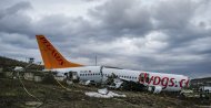 Workers prepare to remove the wreckage of the Pegasus plane after the crash at Sabiha Gökçen Airport, Istanbul, Feb. 7, 2020. (AP Photo) 