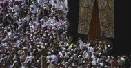 Muslim pilgrims circumambulate the Kaaba, the cubic building toward which Muslim believers turn when praying, at the Grand Mosque, during the minor pilgrimage, known as Umrah, in the Muslim holy city of Mecca, Saudi Arabia, Monday, Feb. 24, 2020. (AP Photo)
