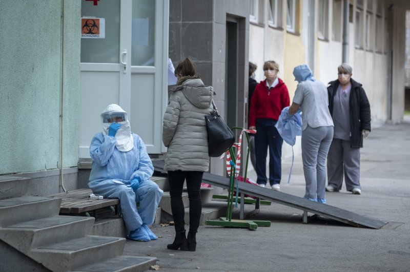 A health worker takes notes at an infectious disease clinic, Zagreb, Feb. 25, 2020. (AP Photo)