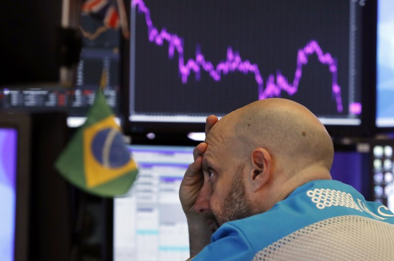 Specialist Meric Greenbaum works at his post on the floor of the New York Stock Exchange, Tuesday, Feb. 25, 2020. (AP Photo)