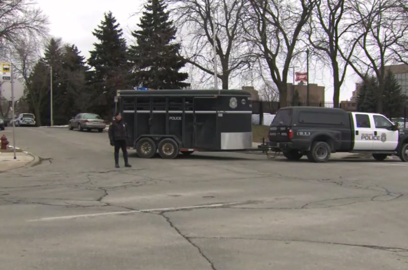 This image provided by WISN-TV, police respond to a possible shooting at the MillerCoors campus in Milwaukee on Wednesday, Feb. 26, 2020. (WISN-TV via AP)
