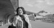 Leyla Gencer basks in the New York sunshine outside Trans-World Airlines terminal building at JFK Airport on Apr. 11, 1973, shortly after her arrival from Milan. (AP Photo)