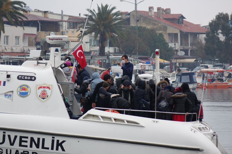 Illegal migrants aboard a Coast Guard boat approaching Ayvacık district of Çanakkale, Turkey, Feb. 21, 2020. (DHA Photo)