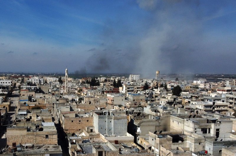 Smoke billows over the town of Saraqib in the eastern part of the Idlib province in northwestern Syria, following bombardment by Assad regime forces, on Feb. 27, 2020. (AFP Photo)