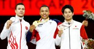 Ahmet Önder (L) poses with gold medalist Joe Fraser (C) and bronze medalist Kazuma Kaya after the 2019 world championships, Stuttgart, Oct. 13, 2019. (Reuters Photo)