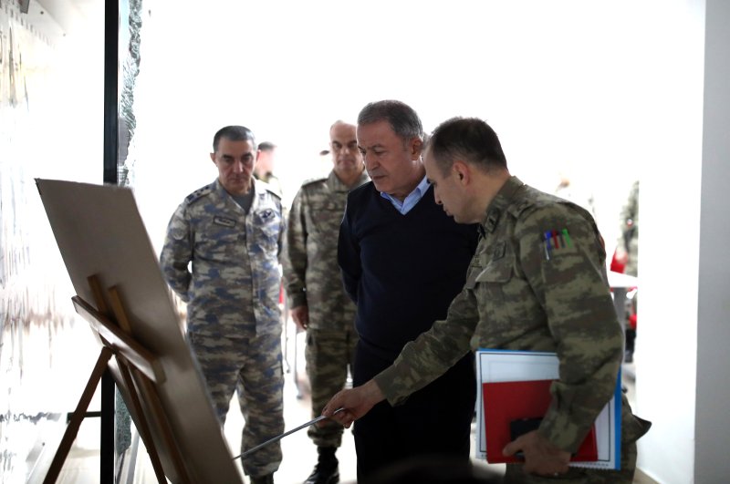 Defense Minister Hulusi Akar at the border with military personnel after the Assad regime's attack on Turkish soldiers, Feb. 27, 2020. (AA Photo)