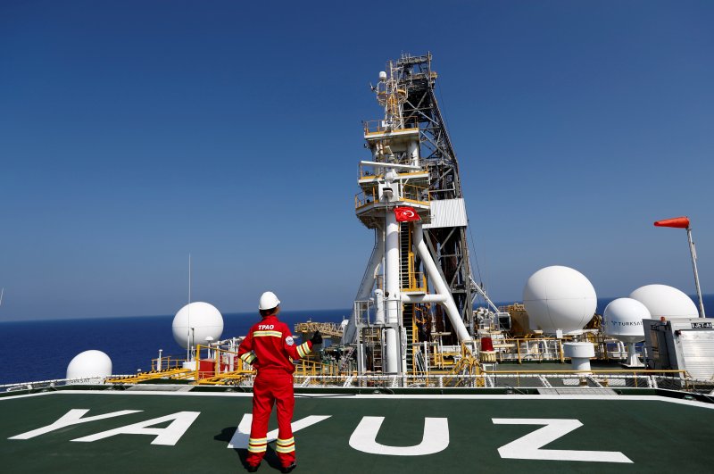 A Turkish Petroleum (TPAO) engineer poses on the helipad of the Turkish drilling vessel Yavuz in the Eastern Mediterranean off Cyprus, Aug. 6, 2019. (Reuters File Photo)