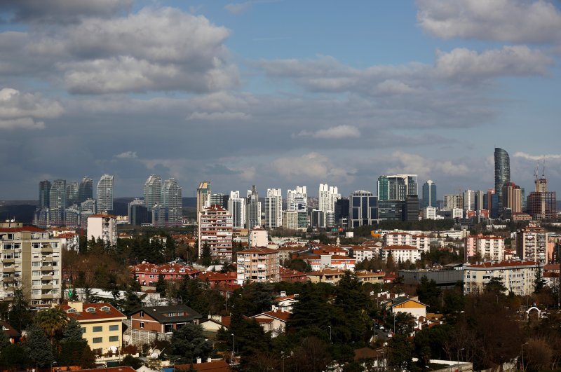 Skyscrapers in the Maslak business and financial district are seen behind residential apartment blocks in Istanbul. (Reuters File Photo)