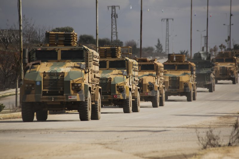 Turkish military convoy drives in Idlib province, Syria, Saturday, Feb. 22, 2020. (AP Photo)