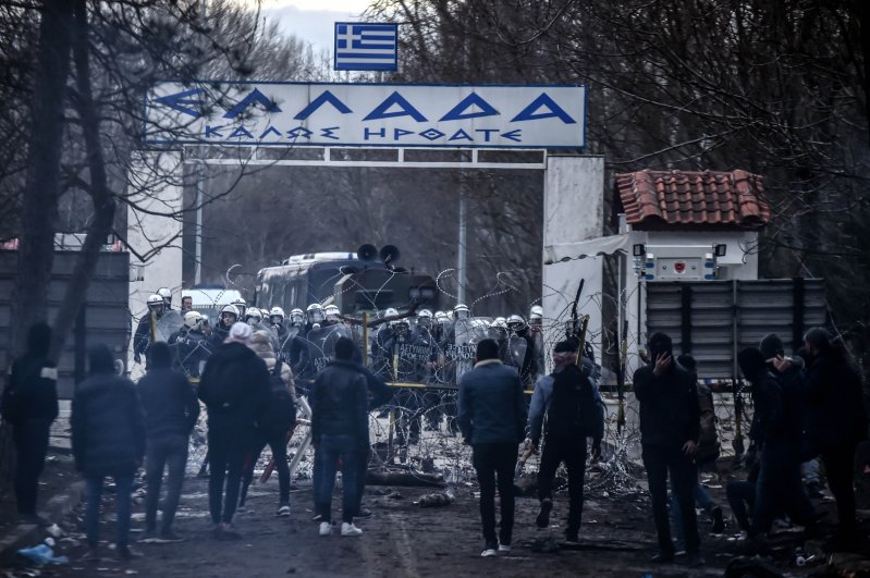 Greek police use tear gas against migrants waiting at the border crossing at Kastanies and Pazarkule to cross to the European Union territories on Feb. 28, 2020. (IHA Photo)