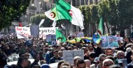 Algerian demonstrators wave the national flag during a demonstration in the capital Algiers, Feb.28, 2020. (AFP Photo)