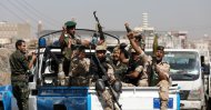 Houthi troops ride on the back of a police patrol truck after participating in a Houthi gathering in Sanaa, Yemen, Feb.19, 2020. (Reuters Photo)