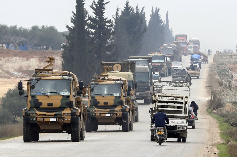 A Turkish military convoy drives in the east of Idlib, Syria, Feb. 28, 2020. (AP Photo)
