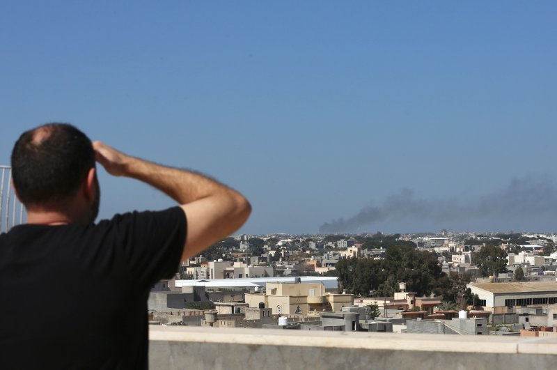 Fire broke out at Libya's Mitiga Airport when forces loyal to eastern-based warlord Khalifa Haftar conducted attacks, disregarding the cease-fire, Feb. 28, 2020 (AA Photo)