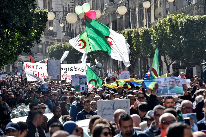 Algerian demonstrators wave the national flag during a demonstration in the capital Algiers, Feb.28, 2020. (AFP Photo)