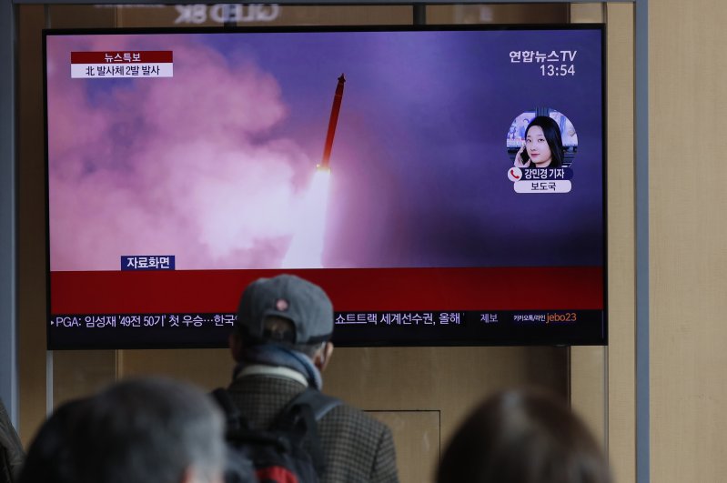 People watch a TV screen showing a news program reporting about North Korea's firing of projectiles with a file image at the Seoul Railway Station in Seoul, South Korea, Monday, March 2, 2020. (AP Photo)