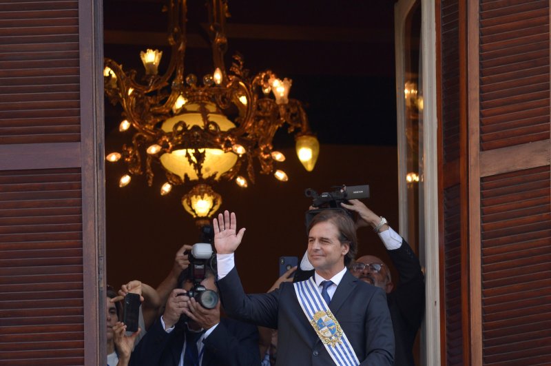 Uruguay's new President Luis Lacalle Pou waves from the Estevez Palace after being sworn into office, Montevideo, March 1, 2020. (REUTERS Photo)