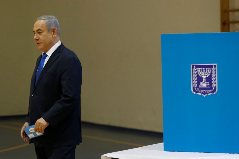 Israeli Prime Minister Benjamin Netanyahu walks to cast his ballot during Israeli parliamentary elections, at a polling station, Jerusalem, March 2, 2020. (Reuters Photo)