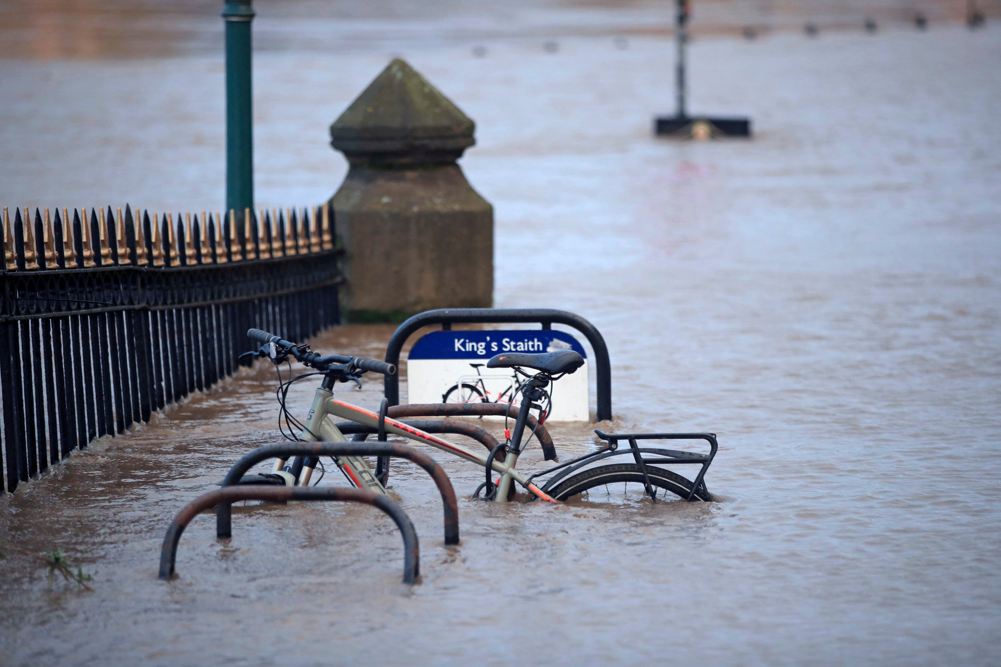 A cycle rack engulfed by floodwater after the River Ouse burst its banks in the aftermath of Storm Ciara, in York, England, Monday, Feb. 10, 2020. (AP Photo)