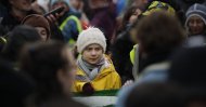 Climate activist Greta Thunberg, from Sweden, center, stands with other protestors as she participates in a school strike climate protest in Bristol, south west England, Feb. 28, 2020. (AP Photo)