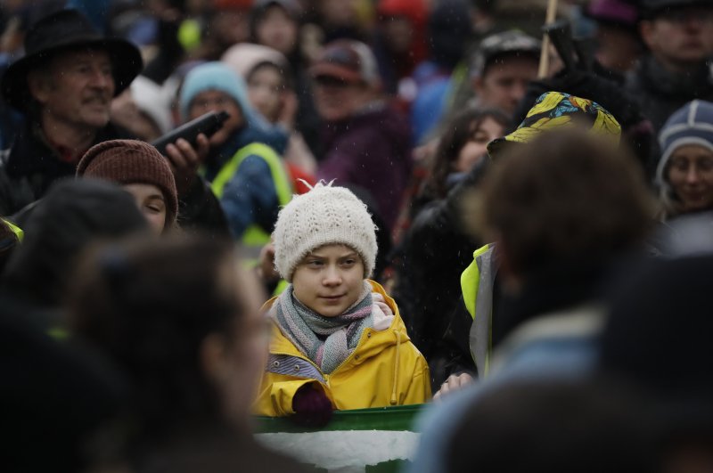 Climate activist Greta Thunberg, from Sweden, center, stands with other protestors as she participates in a school strike climate protest in Bristol, south west England, Feb. 28, 2020. (AP Photo)