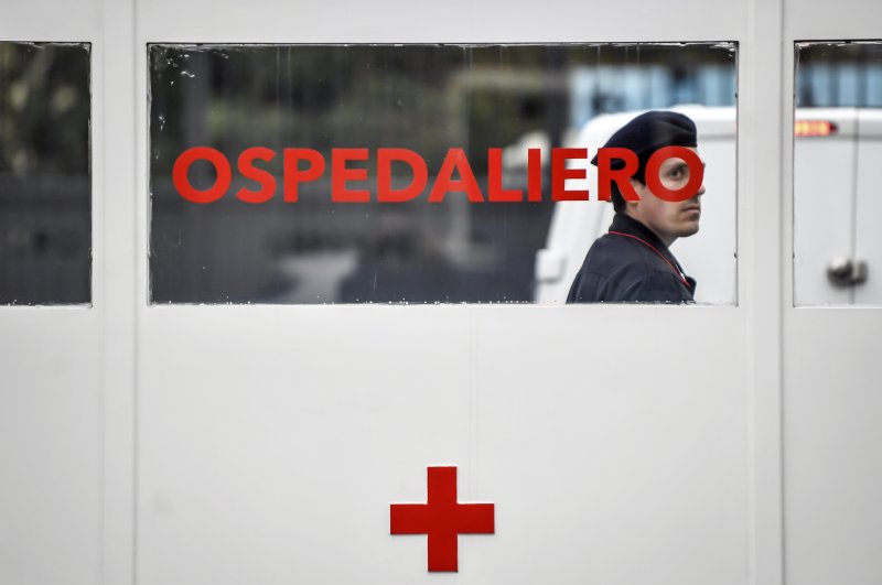 A Carabinieri (Italian paramilitary police) officer on patrol at former military hospital Baggio, which reopened a ward to hospitalize patients recovering from the COVID-19 virus, in Milan, Italy, Tuesday, March 2, 2020. (LaPresse via AP)