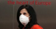 A woman wearing a protective face mask is seen at Brussels Airport, March 4, 2020. (REUTERS Photo)