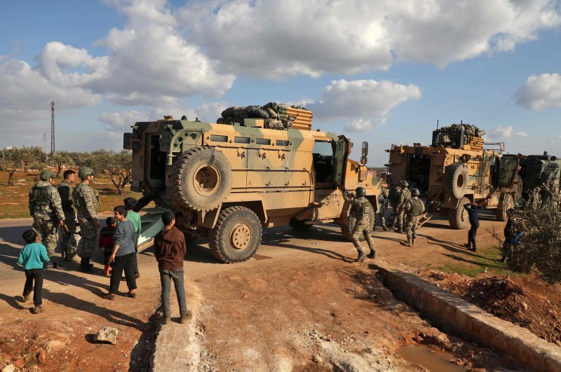 A Turkish military convoy is seen parked near the town of Batabu on the highway linking Idlib to the Syrian Bab al-Hawa border crossing with Turkey, March 2, 2020. (AFP Photo)