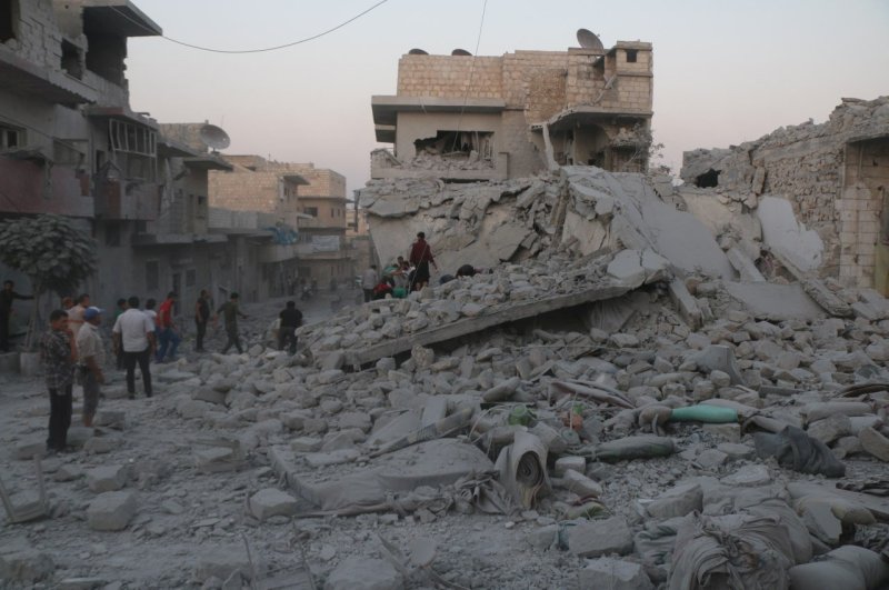 Residents inspect the rubble of damaged buildings and search for victims after a deadly airstrike in Maarat al-Numan, Idlib province, Syria, Aug. 28, 2019. (Reuters Photo)