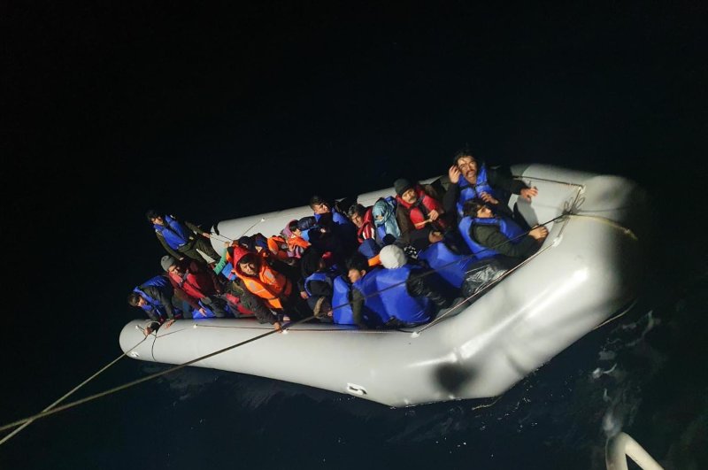 The Turkish coast guard rescued 130 Syrian and Afghan migrants off the coast of the Kuşadası district of Aydın province, March 5, 2020. (DHA Photo)