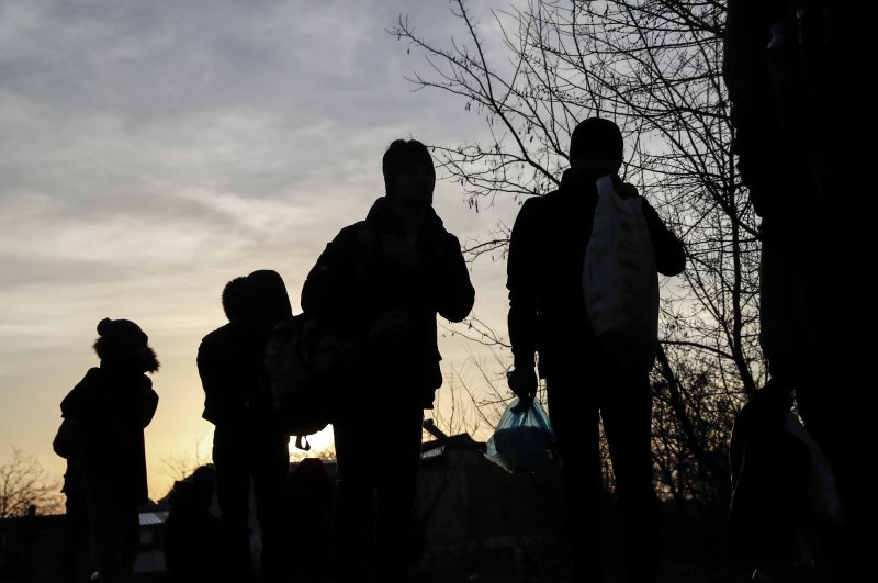 Migrants walk in Edirne near the Turkish-Greek border on Thursday, March 5, 2020. (AP Photo)