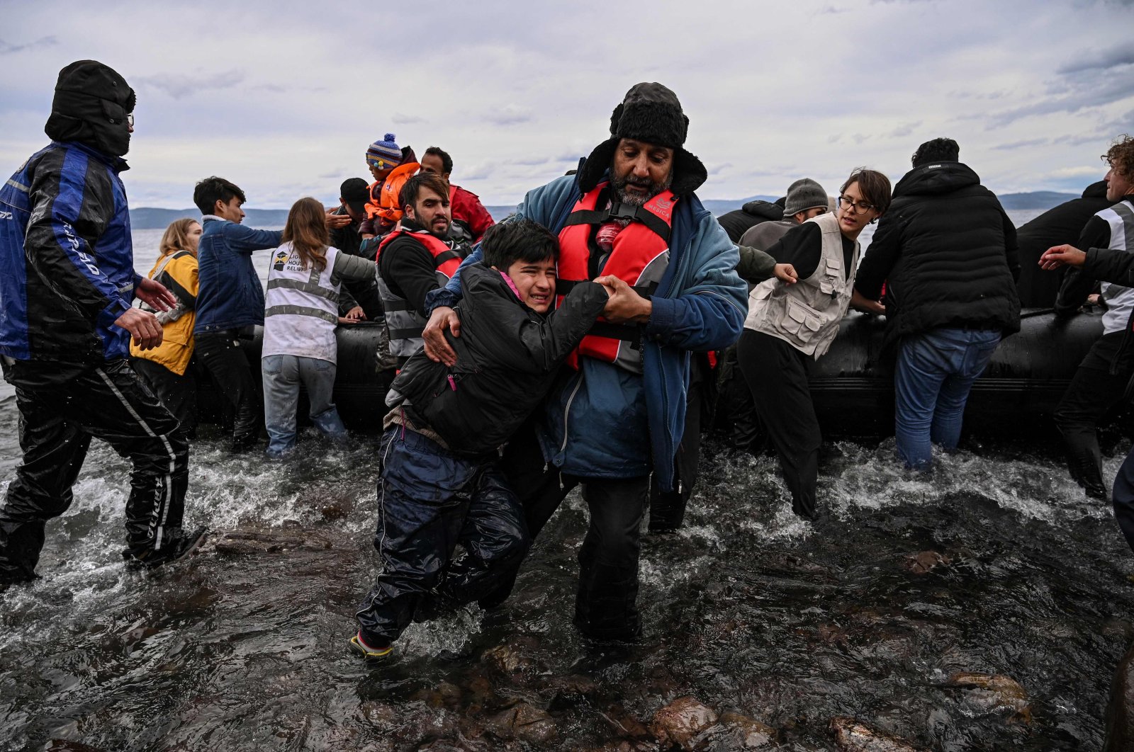 A dinghy transporting 54 Afghan refugees lands in Lesbos island after crossing the Aegean sea between Turkey and Greece on Feb. 28, 2020.  (AFP Photo)