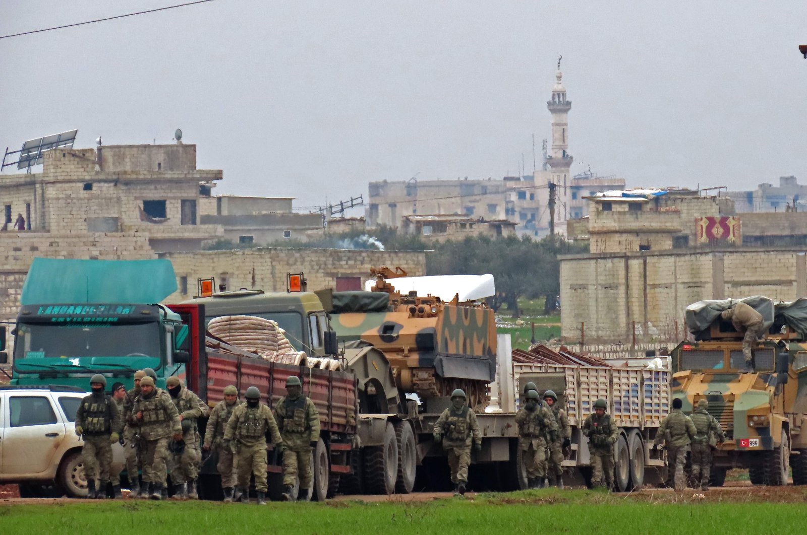 Turkish military vehicles are pictured in the town of Binnish in Syria’s northwestern province of Idlib, near the Syria-Turkey border on Feb. 12, 2020. (AFP Photo)