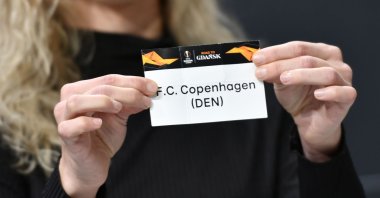 UEFA Europa League ambassador Josephine Henning holds the slip of FC Copenhagen during the UEFA Europa League football cup round of 32 draw ceremony in Nyon, Dec.16, 2019. (AFP Photo)