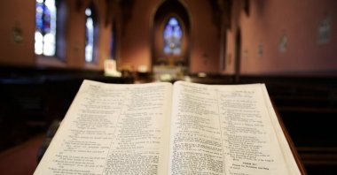 An open Bible is seen inside Holy Cross Cathedral in Boston. (Reuters Photo)