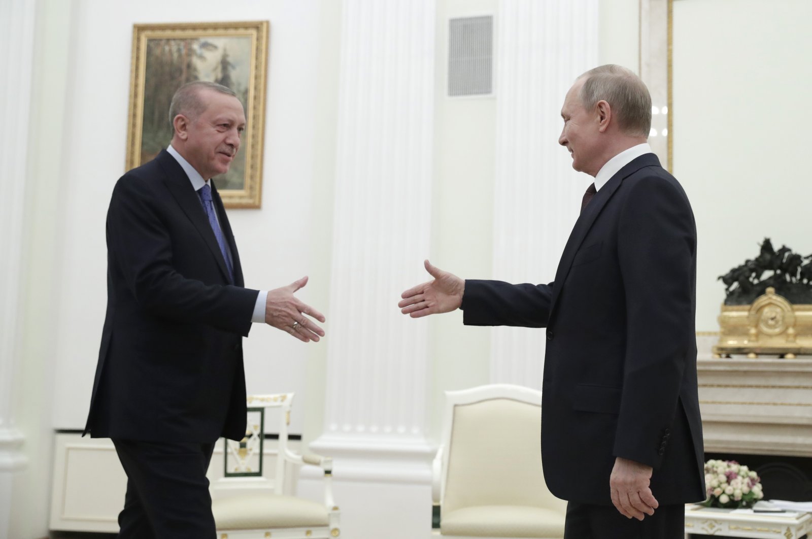 President Recep Tayyip Erdoğan and Russian President Vladimir Putin greet each other prior to their talks on Idlib, at the Kremlin in Moscow, Russia, March 5, 2020. (AP Photo)