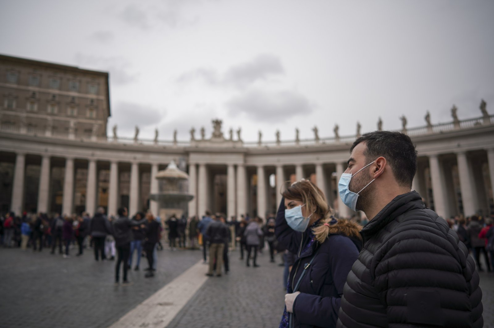 The faithful wear protective masks in St. Peter's Square, at the Vatican, Sunday, March 1, 2020. (AP Photo)