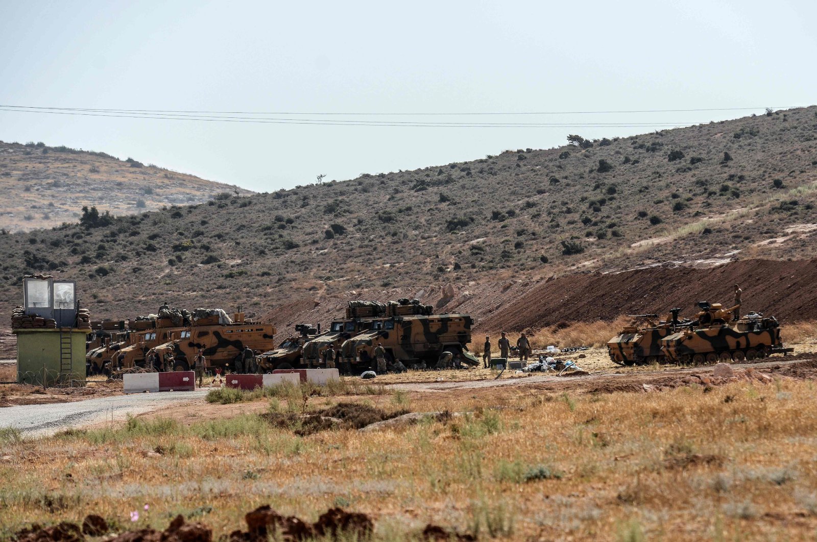 Turkish army armoured vehicles and soldiers wait on October 8, 2017 at Syria-Turkey border at Reyhanli district in Hatay. (AFP File Photo)