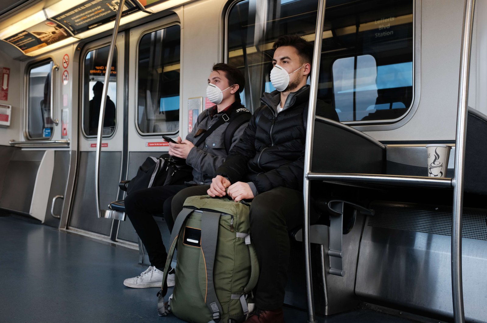  People wear medical masks on the AirTrain as concern over the coronavirus grows enroute to John F. Kennedy Airport (JFK) on March 7, 2020 in New York City. (AFP Photo)