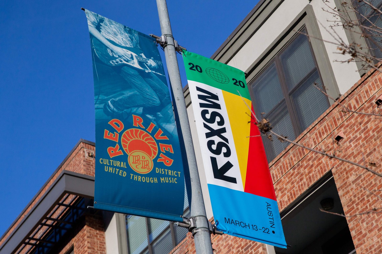 SXSW 2020 banners are seen in the Red River Cultural District on March 6, 2020 in Austin Texas. (AFP Photo)