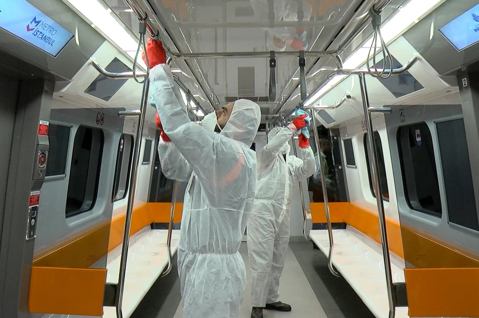 Health workers disinfect Istanbul's metro trains during off hours, March 4, 2020. (DHA Photo)