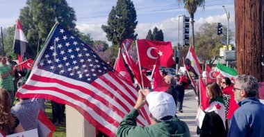Demonstrators carrying Turkish, American and Syrian flags in their hands gathered in Los Angeles' Anaheim city in solidarity with Turkish soldiers in Idlib, March 9, 2020. (IHA PHOTO)