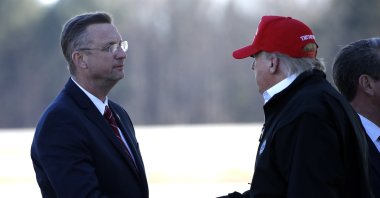President Donald Trump greets Rep. Doug Collins, R-Ga., as he arrives on Air Force One Friday, March 6, 2020, at Dobbins Air Reserve Base in Marietta, Ga. (AP Photo)